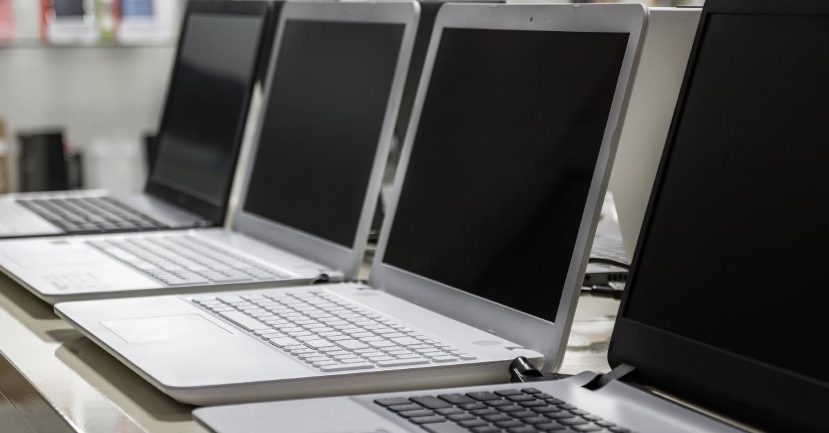 A row of laptops in computer shop