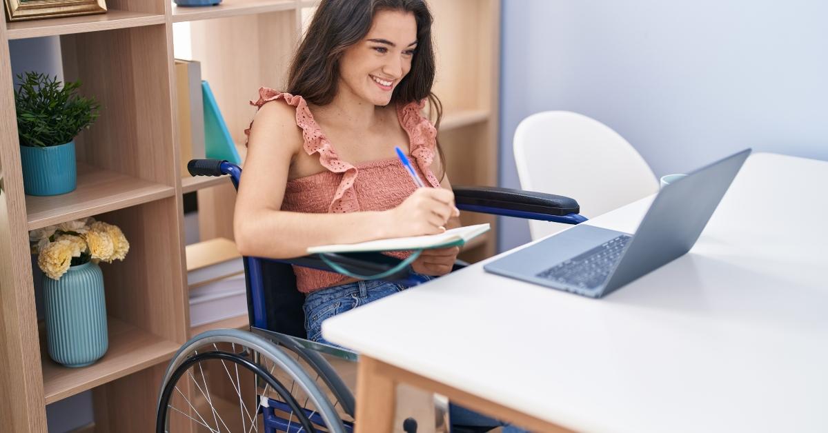 woman sitting on wheelchair studying