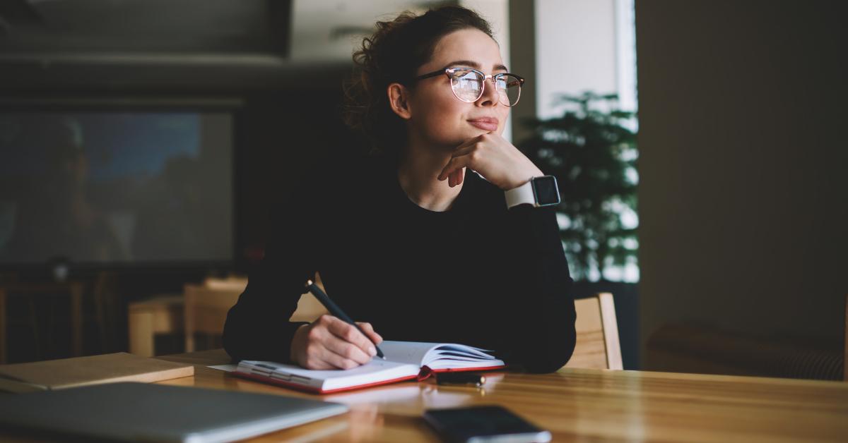 woman thinking on writing interesting article