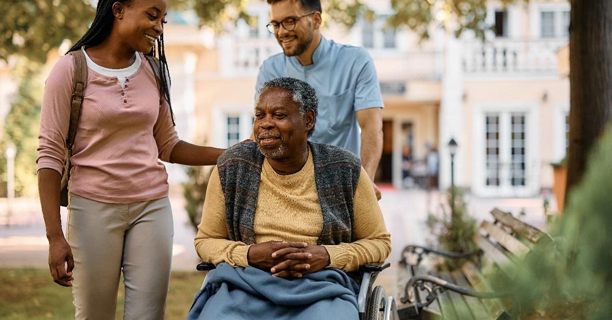 Woman visiting her elderly father at the nursing home