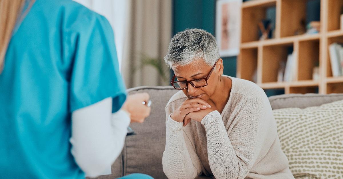 Woman worried during consultation with doctor.