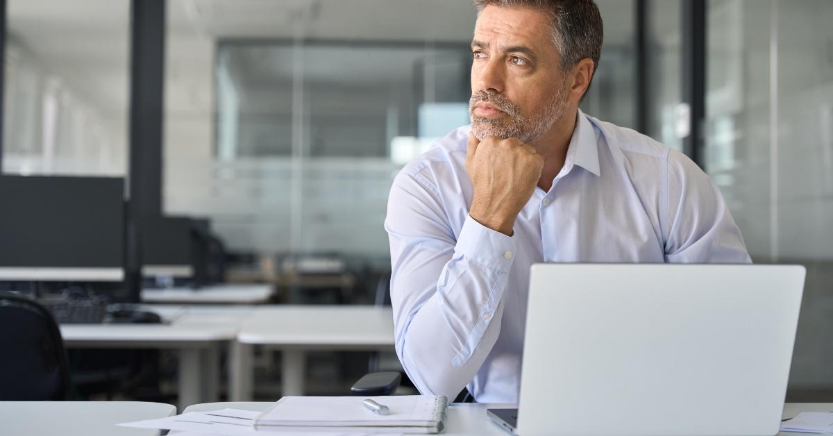 mid age CEO looking away