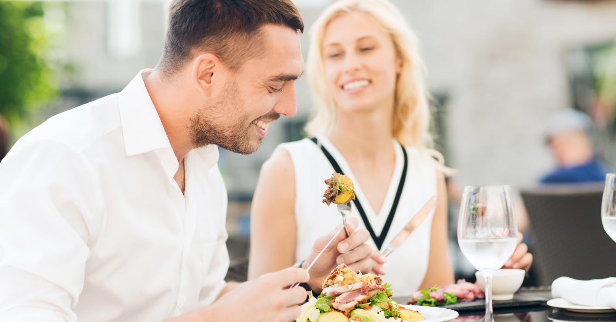 happy couple eating dinner