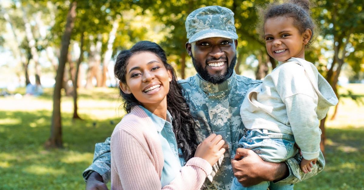 african american soldier posing with family