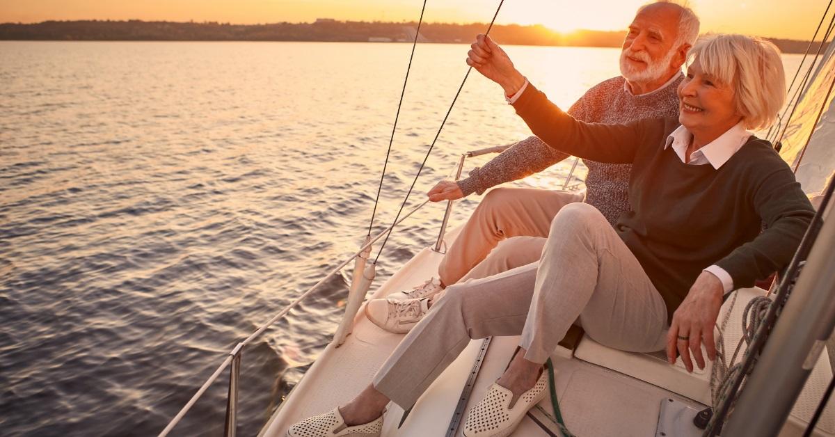 happy senior couple on yacht deck
