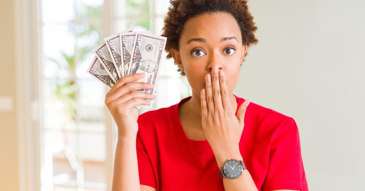  woman holding bank notes