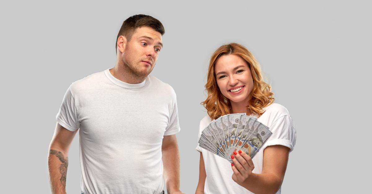 young woman holding money