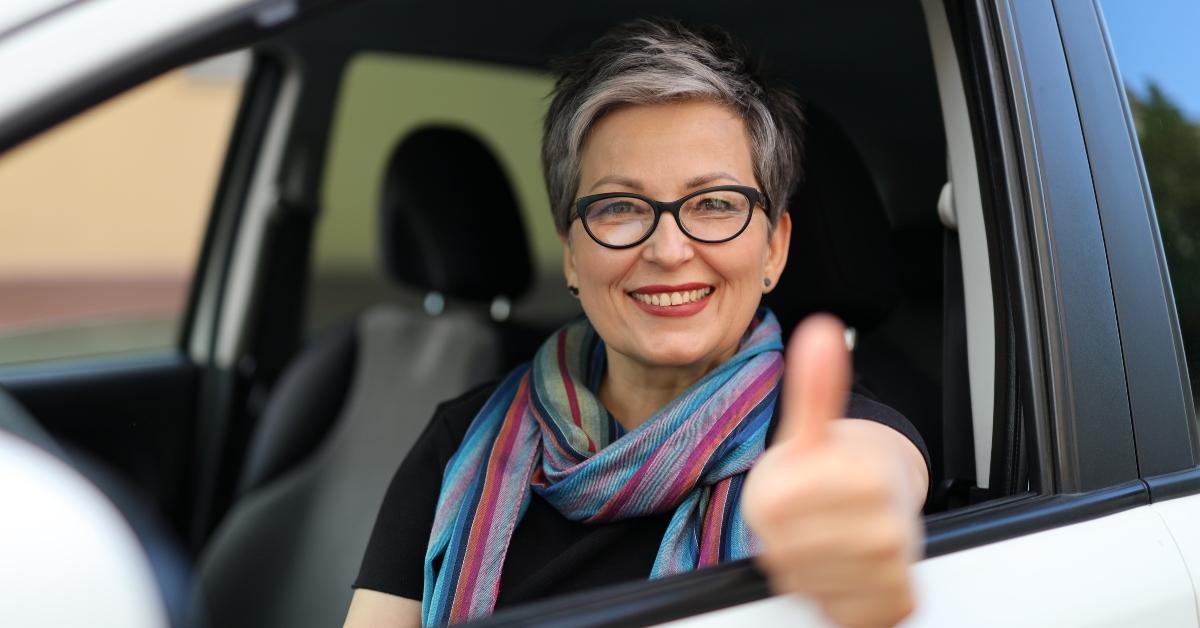 senior woman shows thumbs up