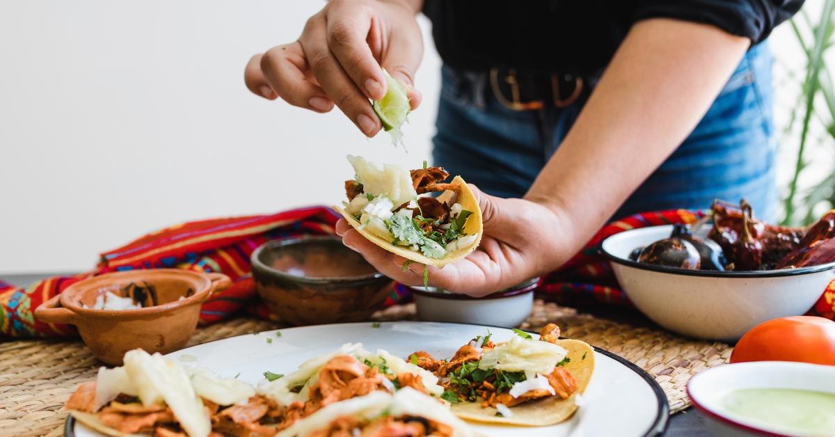 mexican woman hands preparing tacos