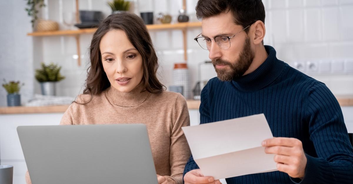 utility costs looking at laptop