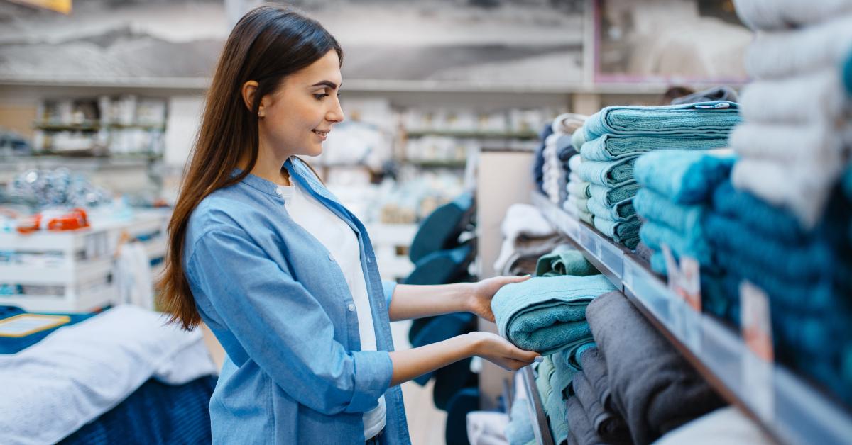 young woman choosing towel
