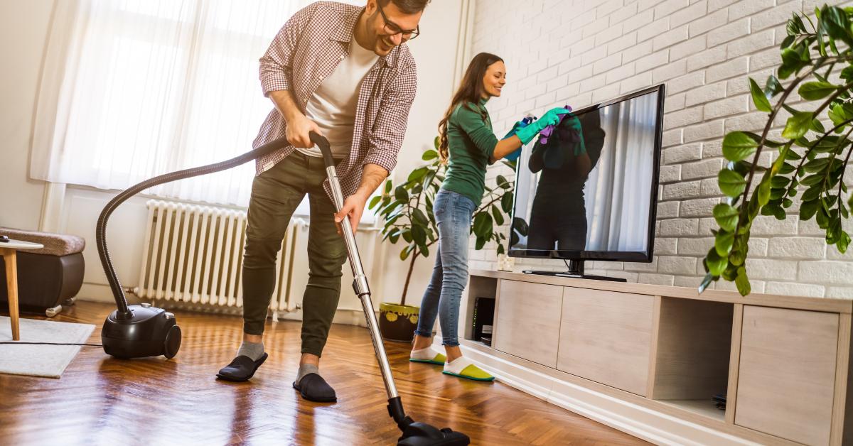 couple is cleaning their apartment