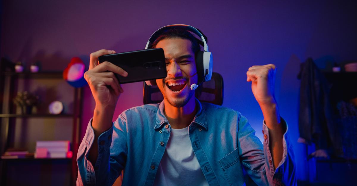 asian gamer wears headphone