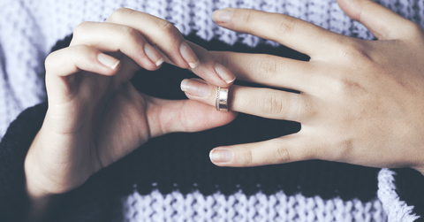 Woman removing wedding ring