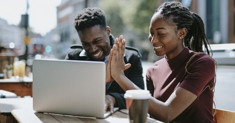 Students giving each other a high five