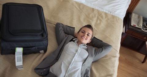 Woman enjoying her hotel room