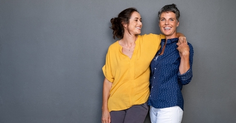 Two women hugging and smiling