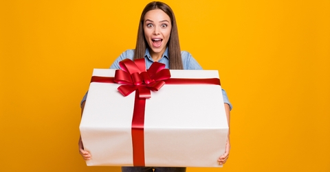 Woman holding large gift box