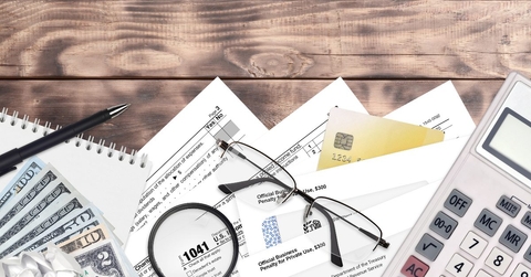 Estate tax forms and papers scattered on a desk 