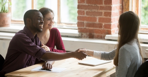 a couple having a meeting with an advisor