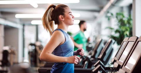 A woman working out on a treadmill