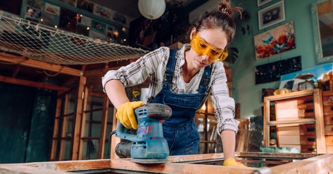 Woman sanding wood