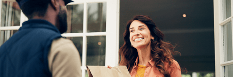 Woman getting a food delivery