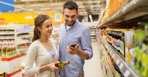 Couple on phone at grocery store