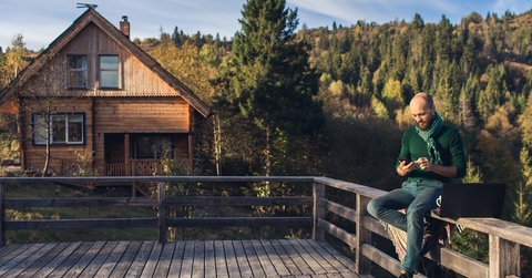 Remote worker at mountain cabin