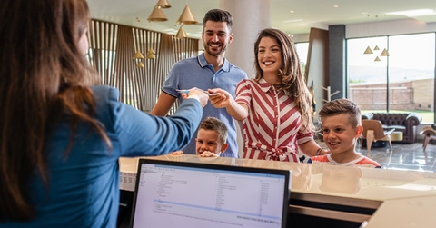 Family checking in at hotel