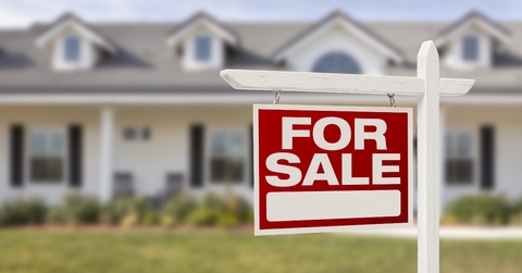 For sale sign outside house