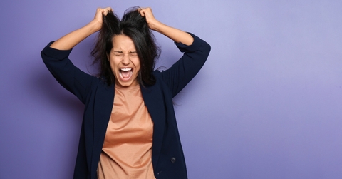 Woman stressed and pulling hair