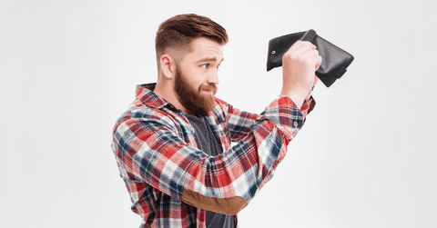 man holding empty wallet
