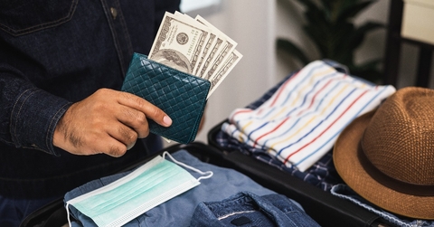 close up traveler hand man getting many cash for travel in the trip 