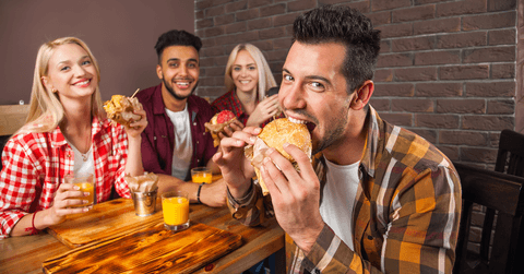 Friends eating burgers