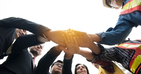 Hands put together to show unity and cooperation