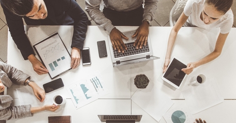 team of young office workers graph