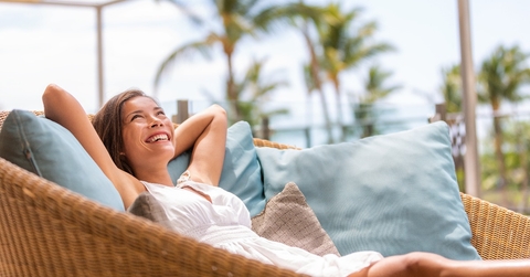 woman enjoying sofa furniture of outdoor patio