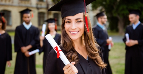 female graduate with diploma in hand