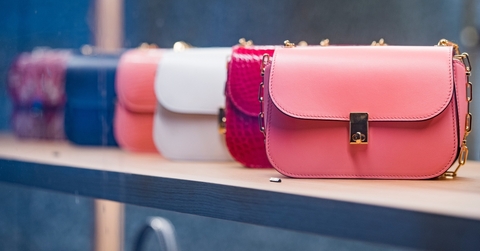 woman purses in a store in Paris