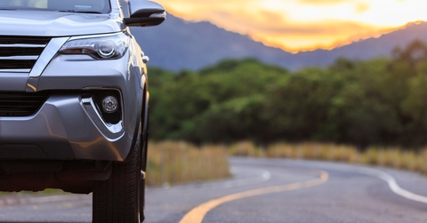 silver SUV car parking on the asphalt road