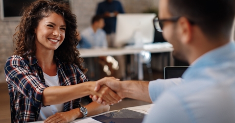 woman signing contracts and handshake with a manager