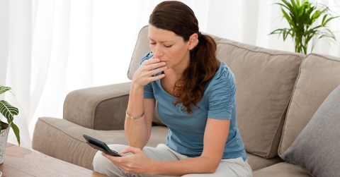 anxious woman calculating her debts