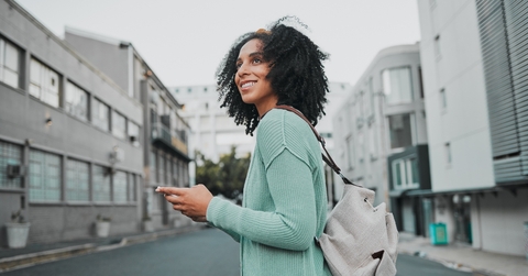 woman with cellphone in the street