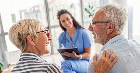 female nurse talking to senior patients