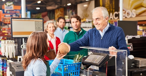 customer paying at the supermarket cashier 