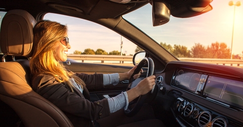 beautiful business woman driving car