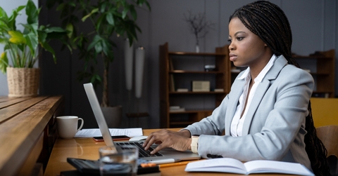 businesswoman types response to customer