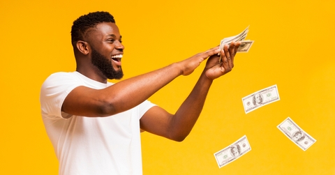 guy throwing out money banknotes