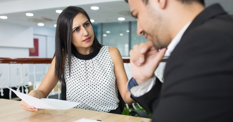 businesswoman in office getting angry over male colleagues